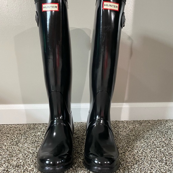 New pair of tall Hunter rain boots with socks